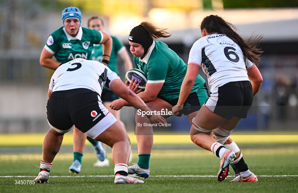 9 May 2026; Ellena Perry of Ireland is tackled by Wales players Sisilia Tuipulotu, left, and Jorja Aiono during the Women's 6 Nations Rugby Championship match between Ireland and Wales at Affidea Stadium in Belfast. Photo by Shauna Clinton/Sportsfile