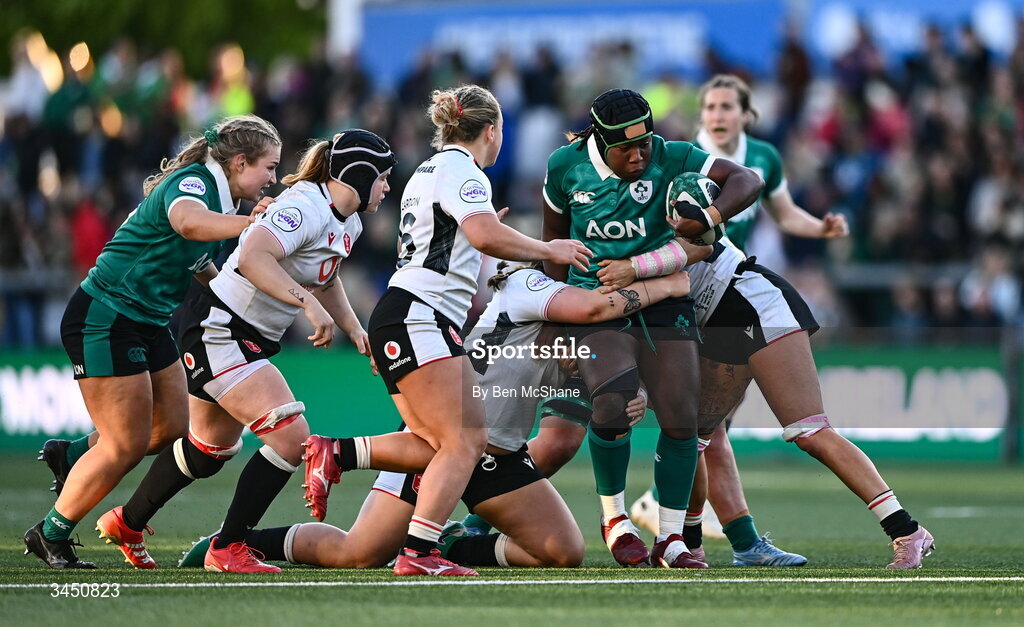 9 May 2026; Linda Djougang of Ireland is tackled by Maisie Davies, left, and Georgia Evans of Wales during the Women's 6 Nations Rugby Championship match between Ireland and Wales at Affidea Stadium in Belfast. Photo by Ben McShane/Sportsfile