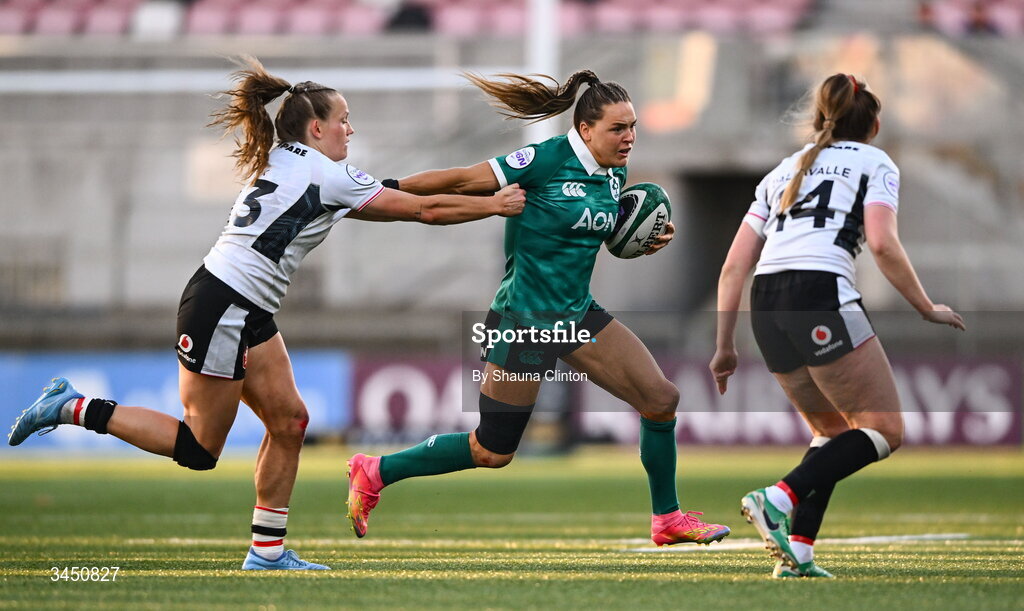 9 May 2026; Béibhinn Parsons of Ireland in action against Wales players Carys Cox, left, and Hannah Dallavalle during the Women's 6 Nations Rugby Championship match between Ireland and Wales at Affidea Stadium in Belfast. Photo by Shauna Clinton/Sportsfile