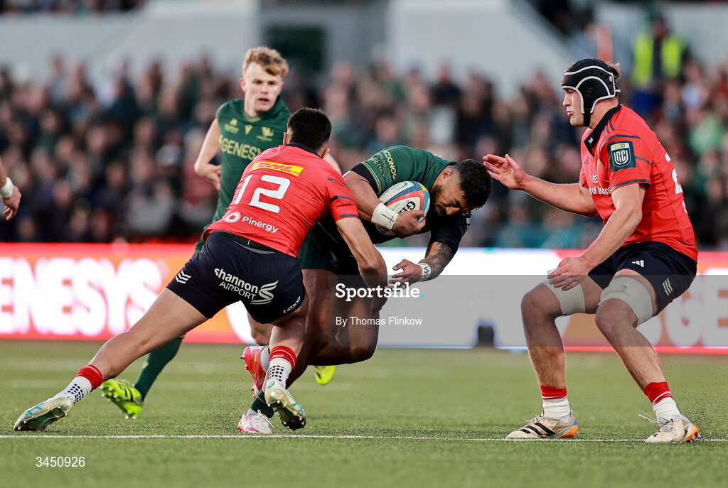 9 May 2026; Bundee Aki of Connacht is tackled by Dan Kelly, left, and Brian Gleeson of Munster during the United Rugby Championship match between Connacht and Munster at Dexcom Stadium in Galway. Photo by Thomas Flinkow/Sportsfile
