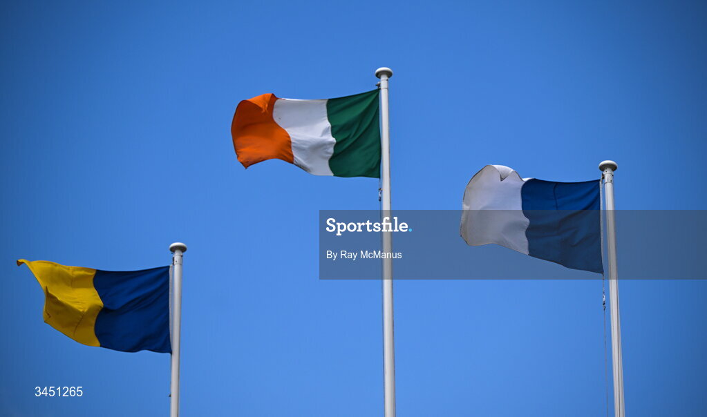 10 May 2026; The Irish Tricolour along with the flags of, from left, Wicklow and Laois flying inside the ground before the Táilteann Cup round 1 match between Laois and Wicklow at Laois Hire O'Moore Park in Portlaoise, Laois. Photo by Ray McManus/Sportsfile