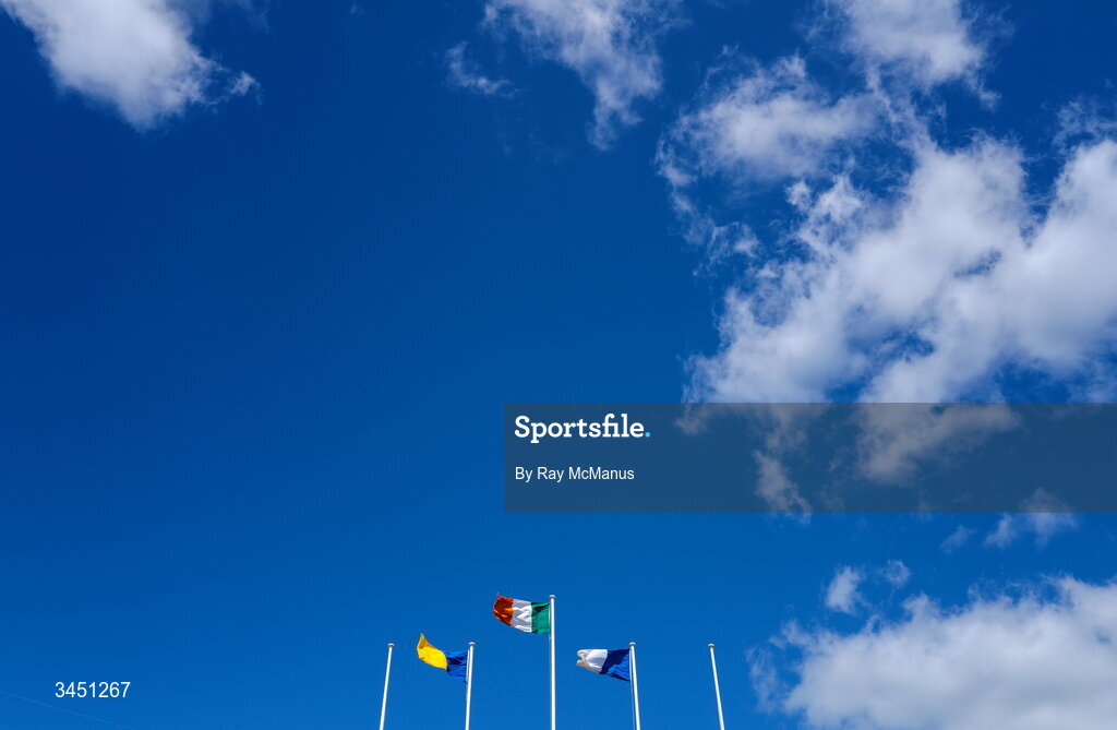 10 May 2026; The Irish Tricolour along with the flags of, from left, Wicklow and Laois flying inside the ground before the Táilteann Cup round 1 match between Laois and Wicklow at Laois Hire O'Moore Park in Portlaoise, Laois. Photo by Ray McManus/Sportsfile