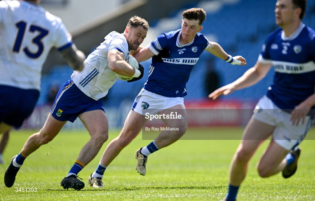 10 May 2026; Dean Healy of Wicklow is tackled by Conor Heffernan of Laois during the Táilteann Cup round 1 match between Laois and Wicklow at Laois Hire O'Moore Park in Portlaoise, Laois. Photo by Ray McManus/Sportsfile
