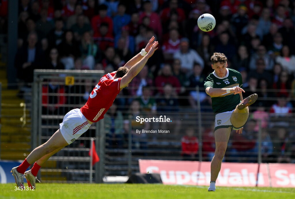 10 May 2026; David Clifford of Kerry kicks a score despite the efforts of Daniel O’Mahony of Cork during the Munster GAA Football Senior Championship final match between Kerry and Cork at Fitzgerald Stadium in Killarney, Kerry. Photo by Brendan Moran/Sportsfile