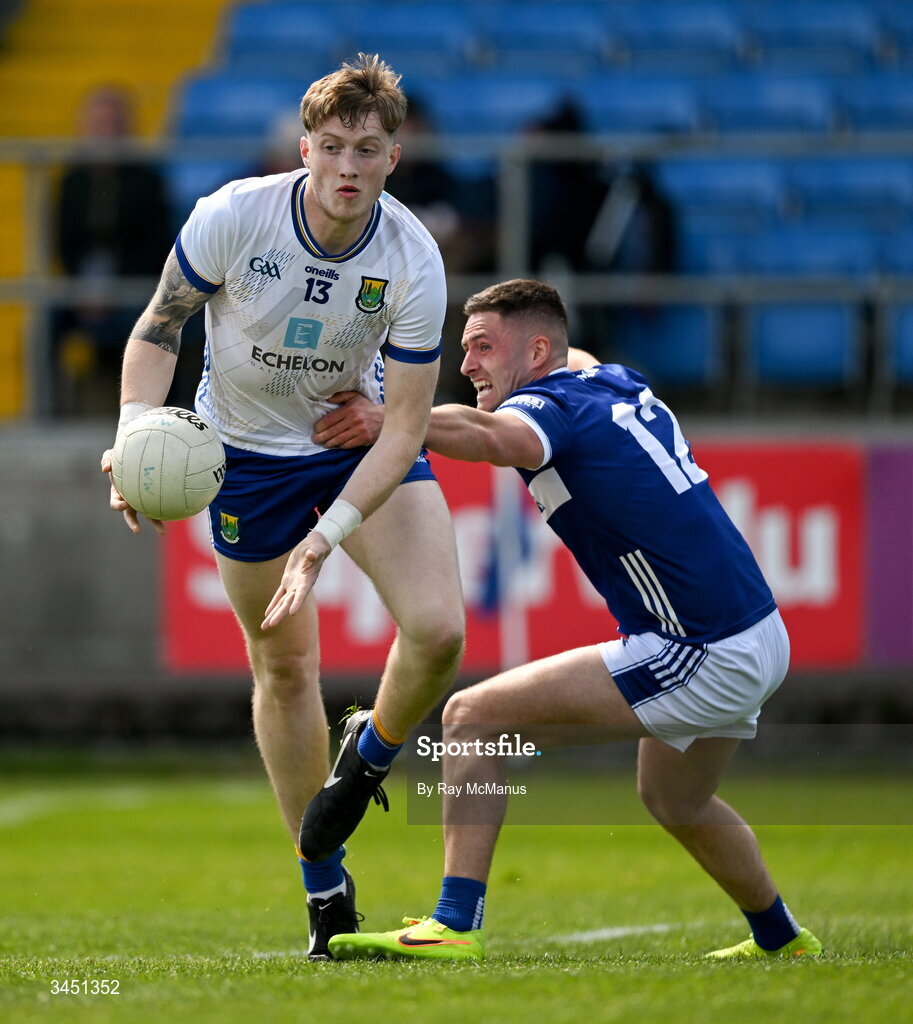 10 May 2026; Oisin McGraynor of Wicklow is tackled by Patrick O'Sullivan of Laois during the Táilteann Cup round 1 match between Laois and Wicklow at Laois Hire O'Moore Park in Portlaoise, Laois. Photo by Ray McManus/Sportsfile