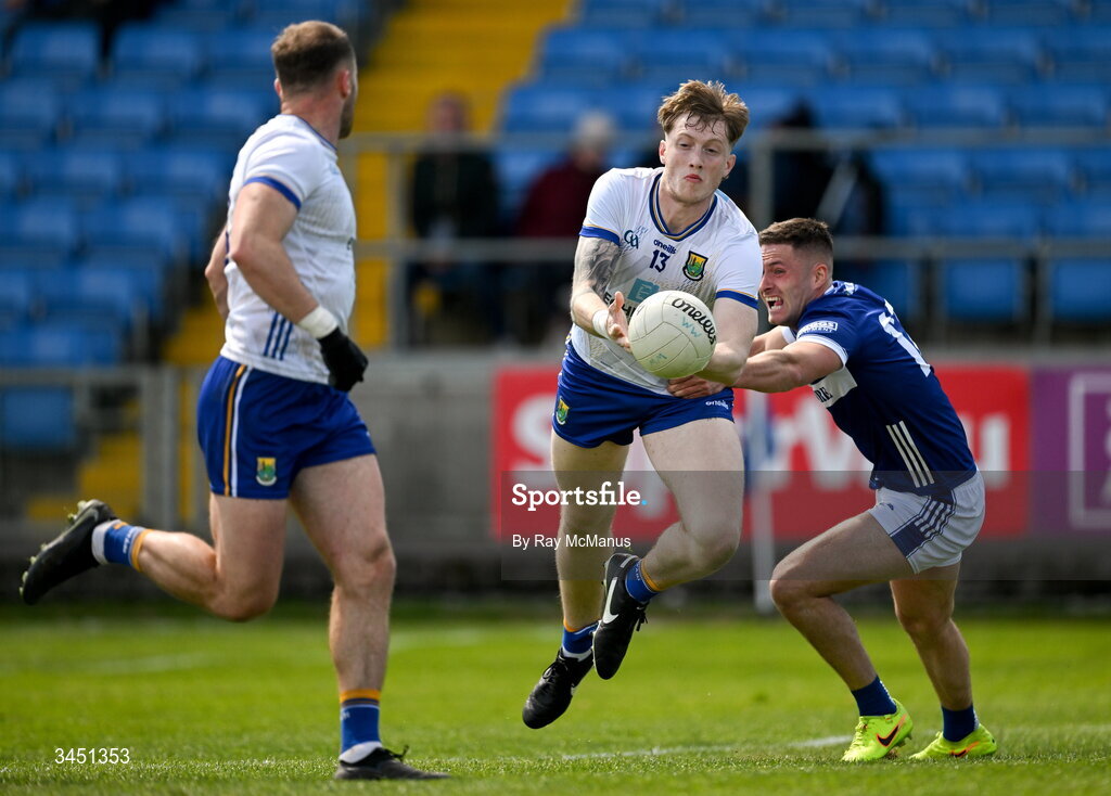10 May 2026; Oisin McGraynor of Wicklow passes the ball to Dean Healy as he is tackled by Patrick O'Sullivan of Laois during the Táilteann Cup round 1 match between Laois and Wicklow at Laois Hire O'Moore Park in Portlaoise, Laois. Photo by Ray McManus/Sportsfile