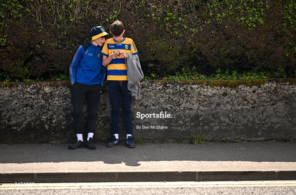 10 May 2026; Roscommon supporters Dylan Cryan, left, and Liam Dixon from Tulsk, Roscommon, check the score of the Munster GAA Football Senior Championship Final on their phone before the Connacht GAA Football Senior Championship final match between Roscommon and Galway at King & Moffatt Dr Hyde Park in Roscommon. Photo by Ben McShane/Sportsfile