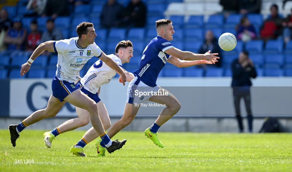 10 May 2026; Patrick O'Sullivan of Laois in action against Padraig O'Toole, left, and Liam O'Neill of Wicklow during the Táilteann Cup round 1 match between Laois and Wicklow at Laois Hire O'Moore Park in Portlaoise, Laois. Photo by Ray McManus/Sportsfile