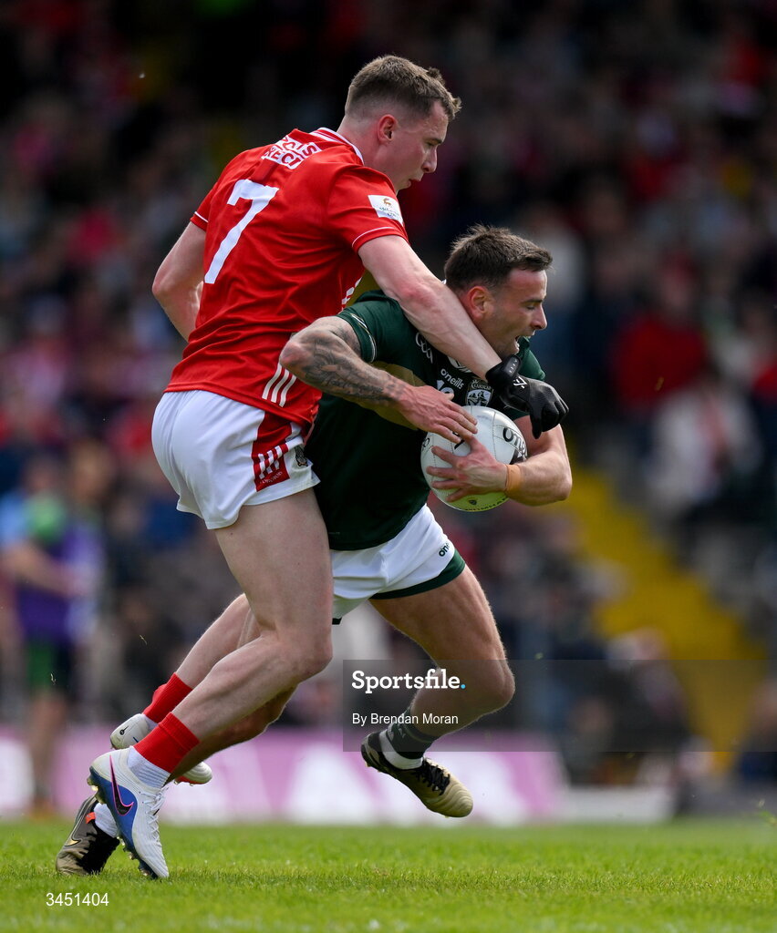 10 May 2026; Micheál Burns of Kerry is tackled by Luke Fahy of Cork during the Munster GAA Football Senior Championship final match between Kerry and Cork at Fitzgerald Stadium in Killarney, Kerry. Photo by Brendan Moran/Sportsfile