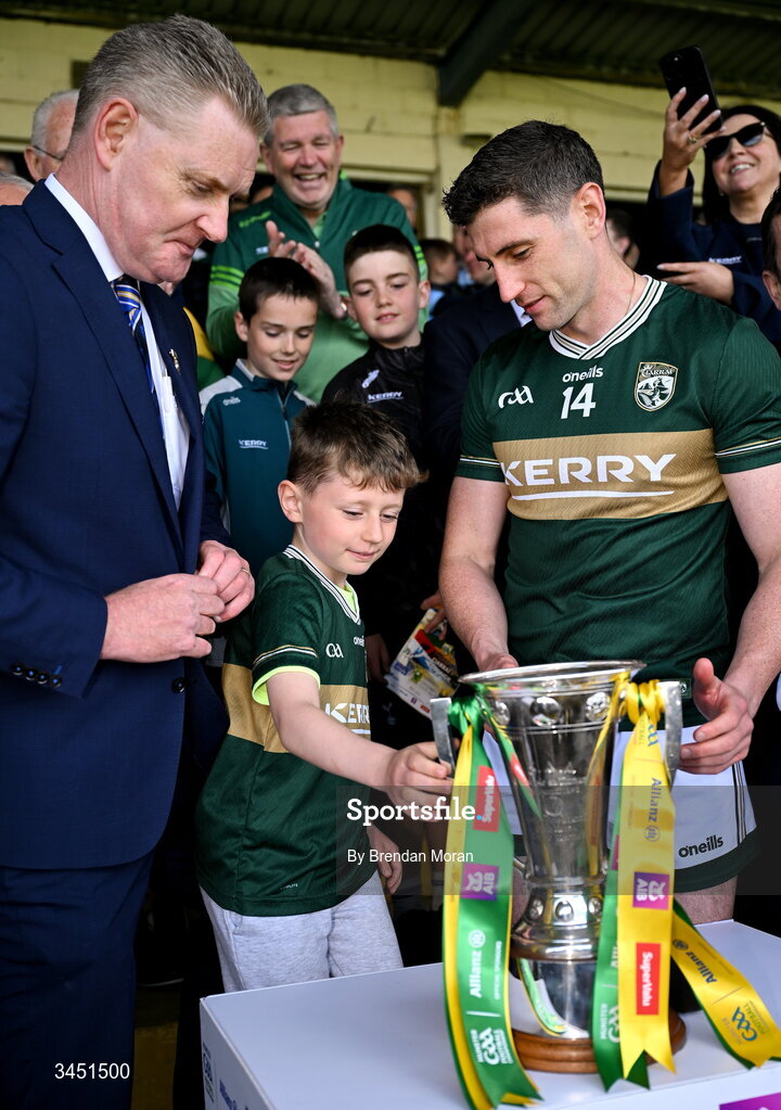 10 May 2026; Páidí Geaney presents to his father, Kerry captain Paul Geaney, the Corn Pháidí Uí Shé, named in honour of his grandfather, legendary Kerry footballer Páidí Ó Sé, after the Munster GAA Football Senior Championship final match between Kerry and Cork at Fitzgerald Stadium in Killarney, Kerry. Photo by Brendan Moran/Sportsfile
