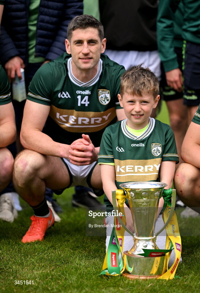 10 May 2026; Kerry captain Paul Geaney and his son Páidí, celebrate with the Corn Pháidí Uí Shé, named in honour of legendary Kerry footballer Páidí Ó Sé, after the Munster GAA Football Senior Championship final match between Kerry and Cork at Fitzgerald Stadium in Killarney, Kerry. Photo by Brendan Moran/Sportsfile