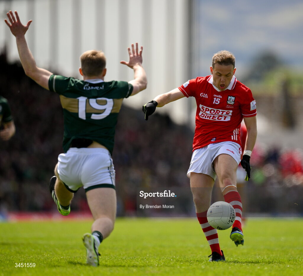 10 May 2026; Steven Sherlock of Cork kicks a score despite the efforts of Killian Spillane of Kerry during the Munster GAA Football Senior Championship final match between Kerry and Cork at Fitzgerald Stadium in Killarney, Kerry. Photo by Brendan Moran/Sportsfile