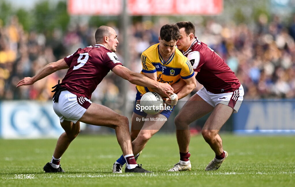 10 May 2026; Eoin Ward of Roscommon is tackled by John Maher, left, and Cillian McDaid of Galway during the Connacht GAA Football Senior Championship final match between Roscommon and Galway at King & Moffatt Dr Hyde Park in Roscommon. Photo by Ben McShane/Sportsfile