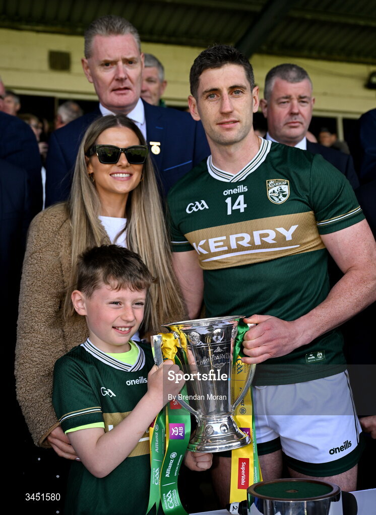 10 May 2026; Kerry captain Paul Geaney with his wife Siún and son Páidí, and the Corn Pháidí Uí Shé, named in honour of legendary Kerry footballer Páidí Ó Sé, after the Munster GAA Football Senior Championship final match between Kerry and Cork at Fitzgerald Stadium in Killarney, Kerry. Photo by Brendan Moran/Sportsfile