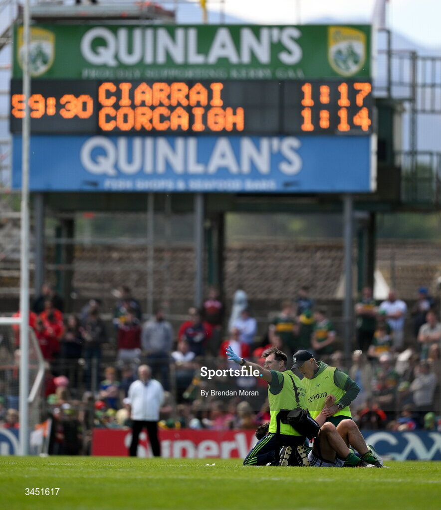 10 May 2026; Kerry physio Paudie McQuinn, attending to an injured Mike Breen of Kerry, attempts to get the attention of referee Paul Faloon after Cork scored a goal, during the Munster GAA Football Senior Championship final match between Kerry and Cork at Fitzgerald Stadium in Killarney, Kerry. Photo by Brendan Moran/Sportsfile