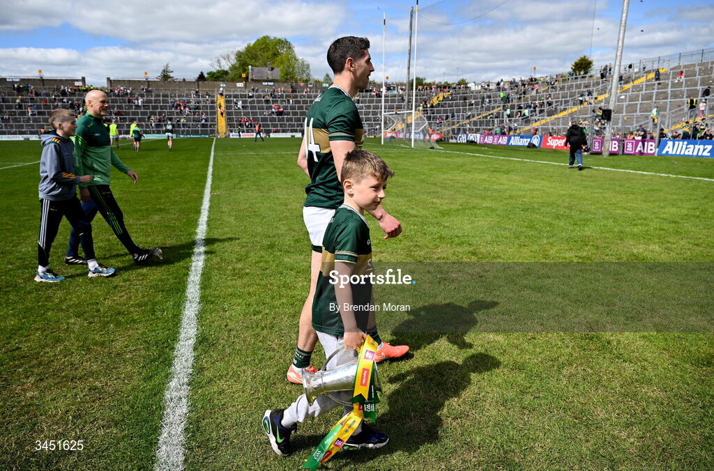 10 May 2026; Páidí Geaney, son of Kerry captain Paul Geaney, carries the Corn Pháidí Uí Shé, named in honour of his grandfather, legendary Kerry footballer Páidí Ó Sé, as they leave the pitch after the Munster GAA Football Senior Championship final match between Kerry and Cork at Fitzgerald Stadium in Killarney, Kerry. Photo by Brendan Moran/Sportsfile