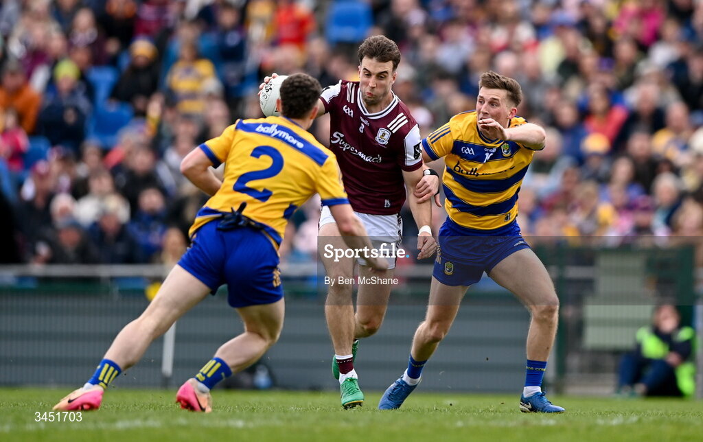 10 May 2026; Paul Conroy of Galway is tackled by Dylan Ruane, right, and Patrick Gavin of Roscommon during the Connacht GAA Football Senior Championship final match between Roscommon and Galway at King & Moffatt Dr Hyde Park in Roscommon. Photo by Ben McShane/Sportsfile