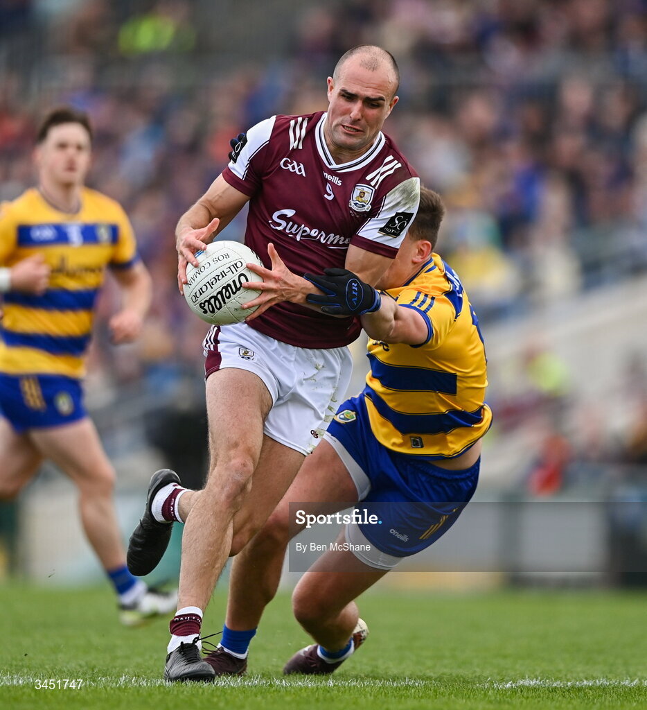 10 May 2026; John Maher of Galway is tackled by Enda Smith of Roscommon during the Connacht GAA Football Senior Championship final match between Roscommon and Galway at King & Moffatt Dr Hyde Park in Roscommon. Photo by Ben McShane/Sportsfile