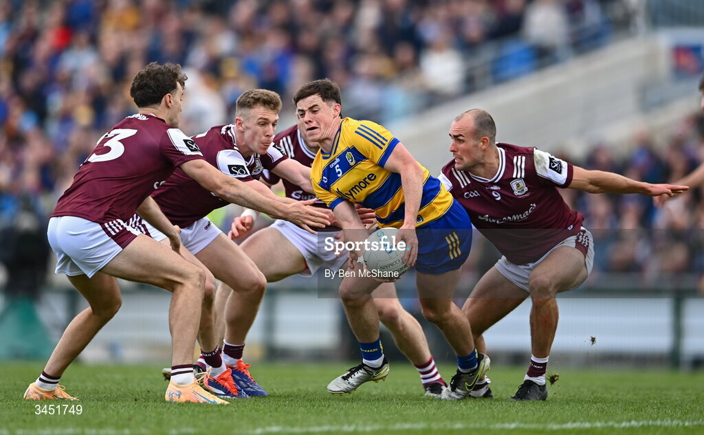 10 May 2026; Eoin Ward of Roscommon in action against Galway players, from left, Finnian Ó Laoi, Dylan McHugh and John Maher during the Connacht GAA Football Senior Championship final match between Roscommon and Galway at King & Moffatt Dr Hyde Park in Roscommon. Photo by Ben McShane/Sportsfile