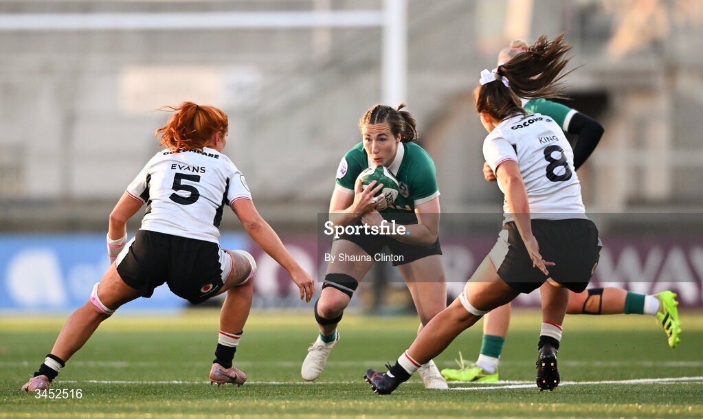 9 May 2026; Eve Higgins of Ireland in action against Wales players Georgia Evans, left, and Bryonie King during the Women's 6 Nations Rugby Championship match between Ireland and Wales at Affidea Stadium in Belfast. Photo by Shauna Clinton/Sportsfile