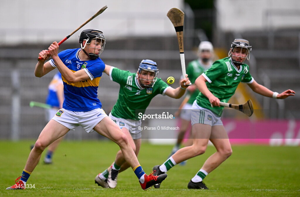 15 May 2026; Shane Ryan of Tipperary in action against Shane Waters and Jack Roche, right, of Limerick during the Electric Ireland Munster GAA Minor Hurling Championship final match between Tipperary and Limerick at FBD Semple Stadium in Thurles, Tipperary. Photo by Piaras Ó Mídheach/Sportsfile