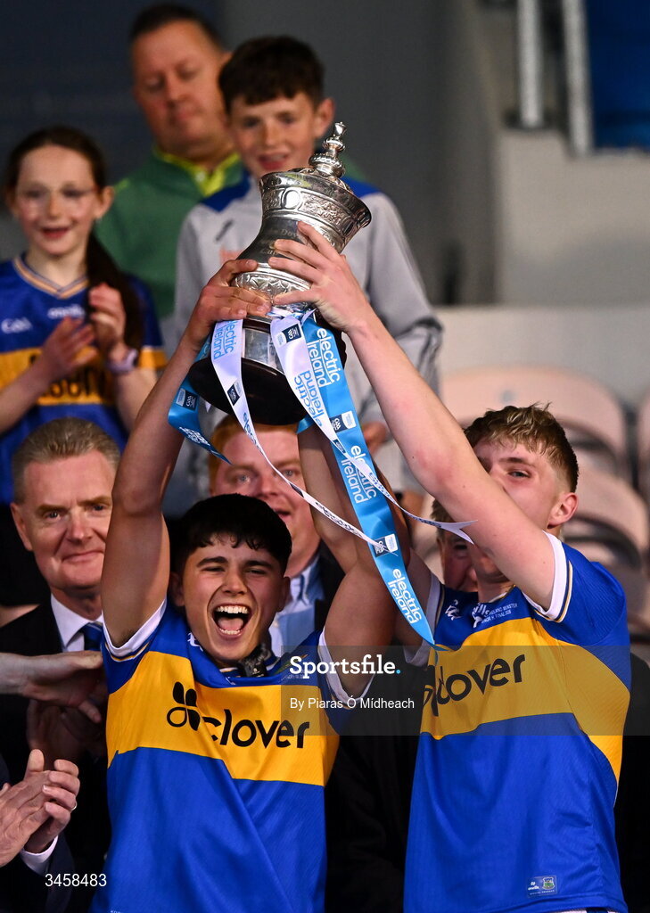 15 May 2026; Tipperary captain Conor Collins, left, and Zach O'Keeffe lift the cup after their side's victory in the Electric Ireland Munster GAA Minor Hurling Championship final match between Tipperary and Limerick at Semple Stadium in Thurles, Tipperary. Photo by Piaras Ó Mídheach/Sportsfile