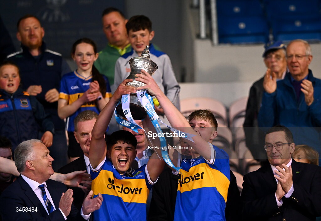 15 May 2026; Tipperary captain Conor Collins, left, and Zach O'Keeffe lift the cup after their side's victory in the Electric Ireland Munster GAA Minor Hurling Championship final match between Tipperary and Limerick at Semple Stadium in Thurles, Tipperary. Photo by Piaras Ó Mídheach/Sportsfile