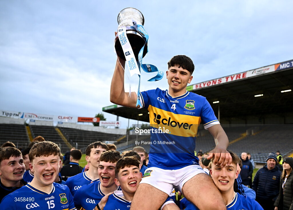 15 May 2026; Tipperary captain Conor Collins is held aloft by team-mates after victory in the Electric Ireland Munster GAA Minor Hurling Championship final match between Tipperary and Limerick at FBD Semple Stadium in Thurles, Tipperary. Photo by Piaras Ó Mídheach/Sportsfile