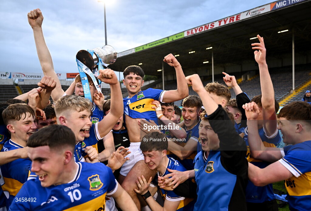 15 May 2026; Tipperary captain Conor Collins is held aloft by team-mates after victory in the Electric Ireland Munster GAA Minor Hurling Championship final match between Tipperary and Limerick at FBD Semple Stadium in Thurles, Tipperary. Photo by Piaras Ó Mídheach/Sportsfile