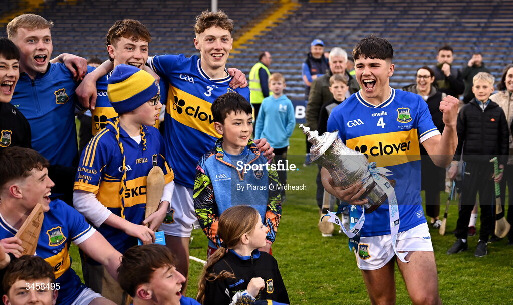 15 May 2026; Tipperary captain Conor Collins brings the cup to his team-mates after victory in the Electric Ireland Munster GAA Minor Hurling Championship final match between Tipperary and Limerick at FBD Semple Stadium in Thurles, Tipperary. Photo by Piaras Ó Mídheach/Sportsfile