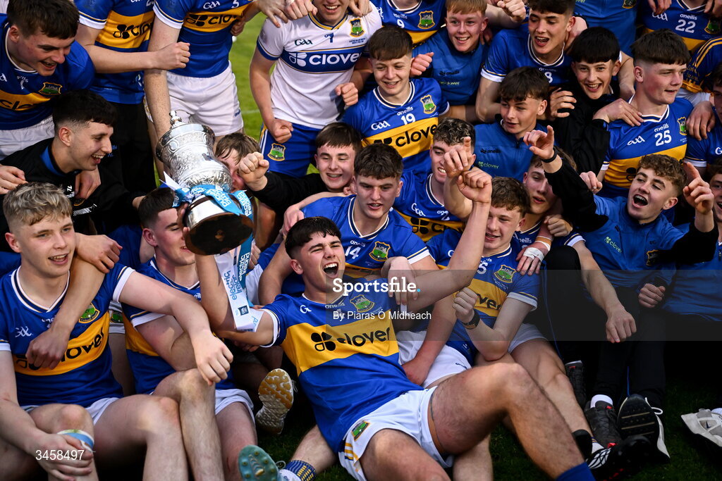 15 May 2026; Tipperary captain Conor Collins, centre, celebrates with team-mates after victory in the Electric Ireland Munster GAA Minor Hurling Championship final match between Tipperary and Limerick at FBD Semple Stadium in Thurles, Tipperary. Photo by Piaras Ó Mídheach/Sportsfile