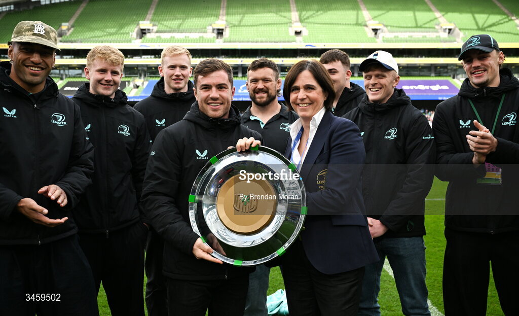 16 May 2026; Luke McGrath of Leinster is presented with the URC Irish shield by Leinster Rugby president Moira Flahive at half-time in the United Rugby Championship match between Leinster and Ospreys at the Aviva Stadium in Dublin. Photo by Brendan Moran/Sportsfile