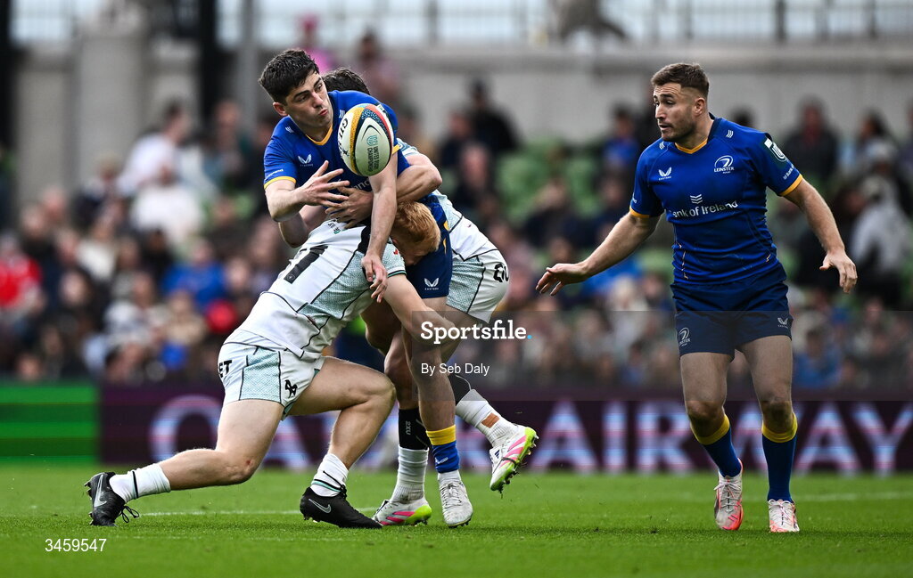 16 May 2026; Jimmy O'Brien of Leinster is tackled by Ospreys players Iestyn Hopkins and Jack Walsh as he off-loads to teammate Jordan Larmour during the United Rugby Championship match between Leinster and Ospreys at the Aviva Stadium in Dublin. Photo by Seb Daly/Sportsfile