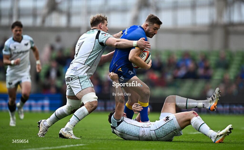 16 May 2026; Jordan Larmour of Leinster is tackled by Ospreys players Jac Morgan and Owen Watkin during the United Rugby Championship match between Leinster and Ospreys at the Aviva Stadium in Dublin. Photo by Seb Daly/Sportsfile