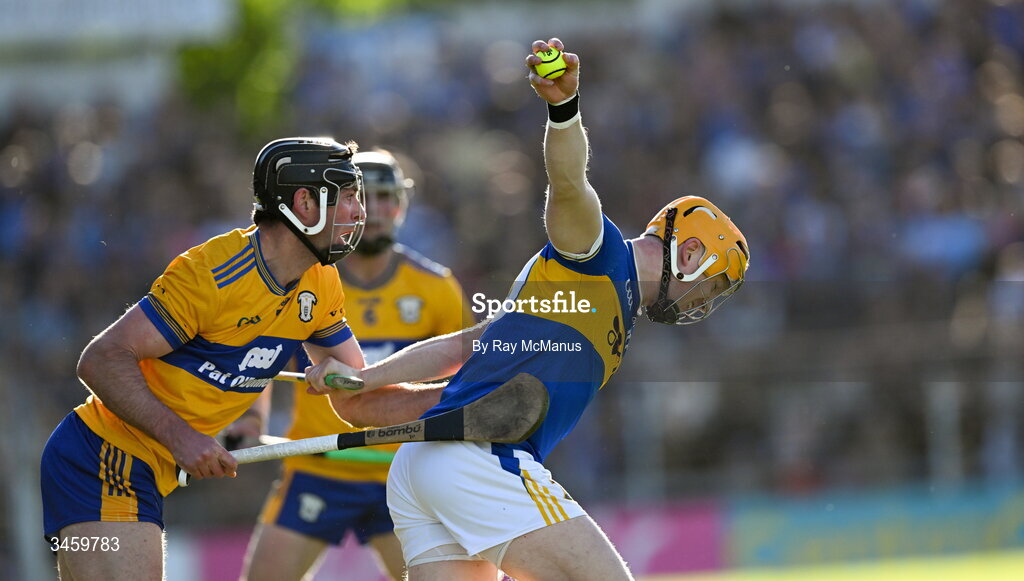 16 May 2026; Jake Morris of Tipperary is tackled by Cathal Malone of Clare during the Munster GAA Senior Hurling Championship Round 4 match between Tipperary and Clare at FBD Semple Stadium in Thurles, Tipperary. Photo by Ray McManus/Sportsfile