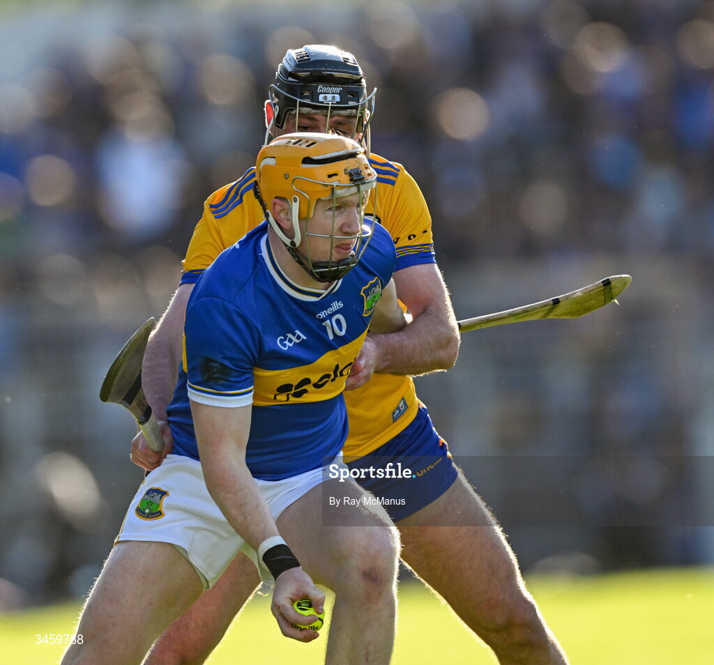 16 May 2026; Jake Morris of Tipperary is tackled by Cathal Malone of Clare during the Munster GAA Senior Hurling Championship Round 4 match between Tipperary and Clare at FBD Semple Stadium in Thurles, Tipperary. Photo by Ray McManus/Sportsfile