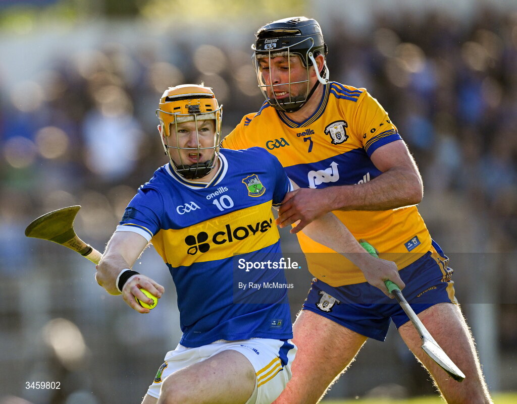 16 May 2026; Jake Morris of Tipperary is tackled by Cathal Malone of Clare during the Munster GAA Senior Hurling Championship Round 4 match between Tipperary and Clare at FBD Semple Stadium in Thurles, Tipperary. Photo by Ray McManus/Sportsfile