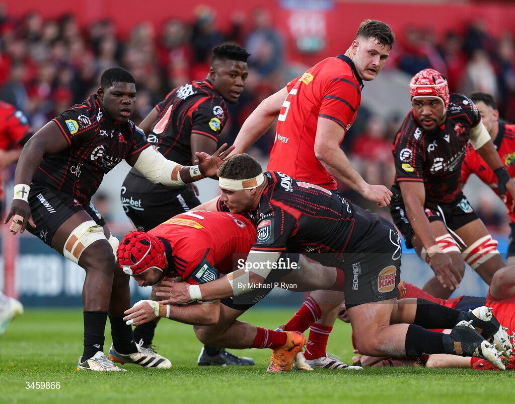 16 May 2026; John Hodnett of Munster is tackled by SJ Kotze of Lions during the United Rugby Championship match between Munster and Lions at Thomond Park in Limerick. Photo by Michael P Ryan/Sportsfile