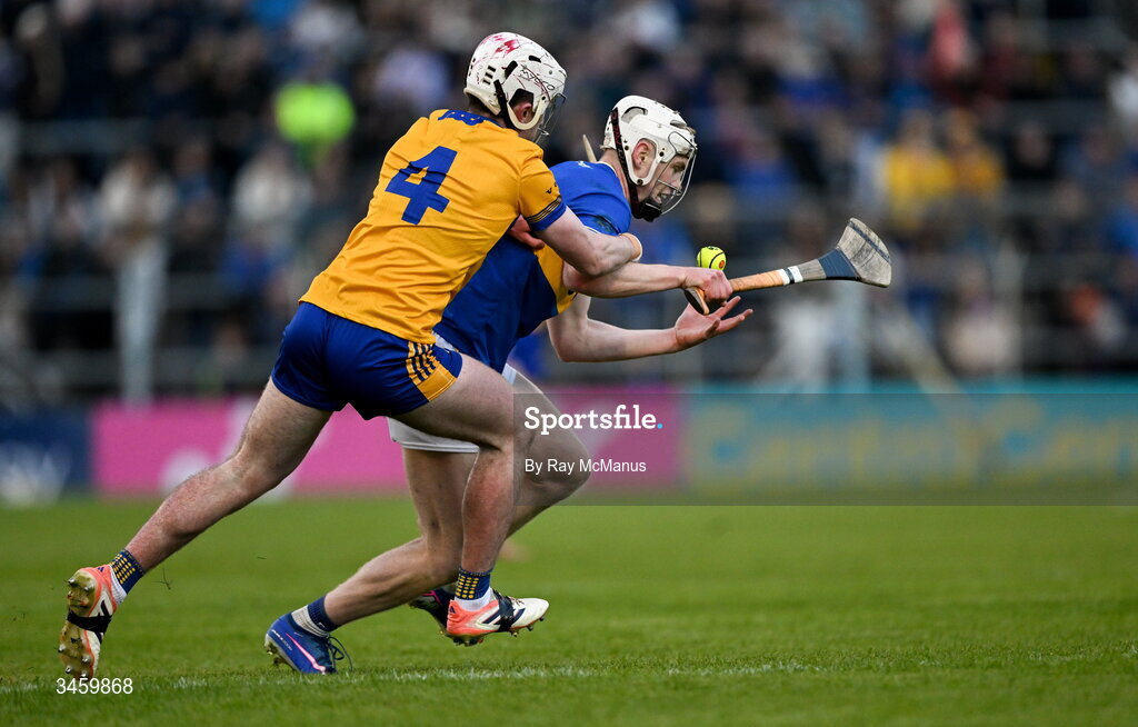 16 May 2026; Oisin O'Donoghue of Tipperary is tackled by Adam Hogan of Clare during the Munster GAA Senior Hurling Championship Round 4 match between Tipperary and Clare at FBD Semple Stadium in Thurles, Tipperary. Photo by Ray McManus/Sportsfile