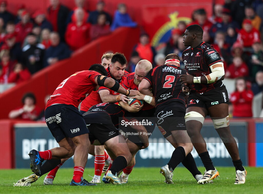 16 May 2026; Jeremy Loughman of Munster is tackled by Sebastian Lombard, left, and PJ Botha of Lions during the United Rugby Championship match between Munster and Lions at Thomond Park in Limerick. Photo by Michael P Ryan/Sportsfile