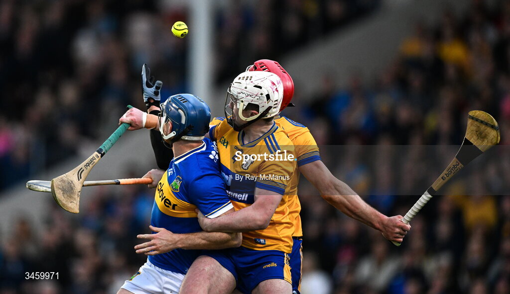 16 May 2026; Jason Forde of Tipperary and Clare players Adam Hogan and John Conlon miss the dropping ball during the Munster GAA Senior Hurling Championship Round 4 match between Tipperary and Clare at FBD Semple Stadium in Thurles, Tipperary. Photo by Ray McManus/Sportsfile
