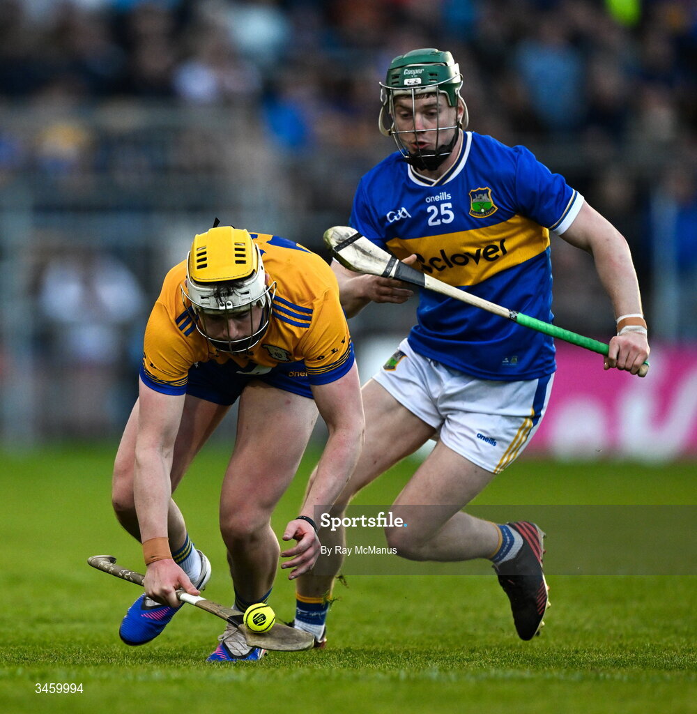 16 May 2026; Sean Rynne of Clare is tackled by Darragh Stakelum of Tipperary during the Munster GAA Senior Hurling Championship Round 4 match between Tipperary and Clare at FBD Semple Stadium in Thurles, Tipperary. Photo by Ray McManus/Sportsfile