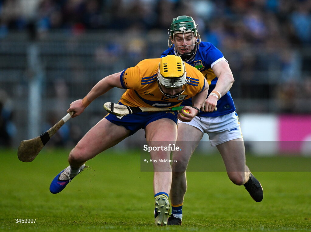 16 May 2026; Sean Rynne of Clare is tackled by Darragh Stakelum of Tipperary during the Munster GAA Senior Hurling Championship Round 4 match between Tipperary and Clare at FBD Semple Stadium in Thurles, Tipperary. Photo by Ray McManus/Sportsfile