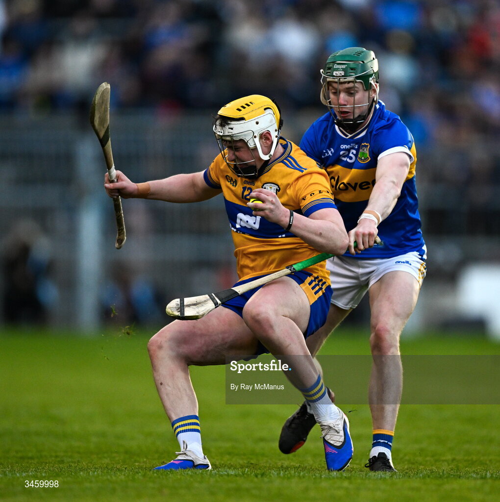 16 May 2026; Sean Rynne of Clare is tackled by Darragh Stakelum of Tipperary during the Munster GAA Senior Hurling Championship Round 4 match between Tipperary and Clare at FBD Semple Stadium in Thurles, Tipperary. Photo by Ray McManus/Sportsfile