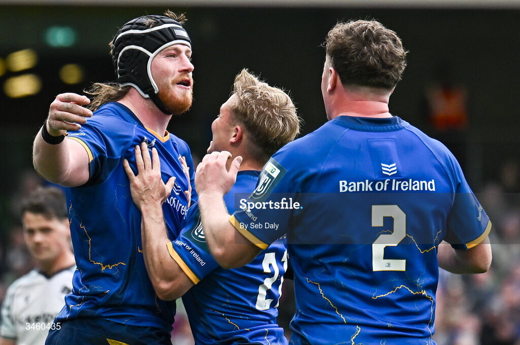 16 May 2026; Joe McCarthy of Leinster, left, celebrates with teammates Gus McCarthy, 2, and Fintan Gunne after scoring their side's seventh try during the United Rugby Championship match between Leinster and Ospreys at the Aviva Stadium in Dublin. Photo by Seb Daly/Sportsfile