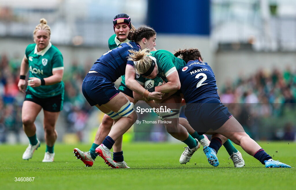 17 May 2026; Sam Monaghan of Ireland in action against Becky Boyd, left, and Elis Martin of Scotland during the Women's 6 Nations Rugby Championship match between Ireland and Scotland at the Aviva Stadium in Dublin. Photo by Thomas Flinkow/Sportsfile