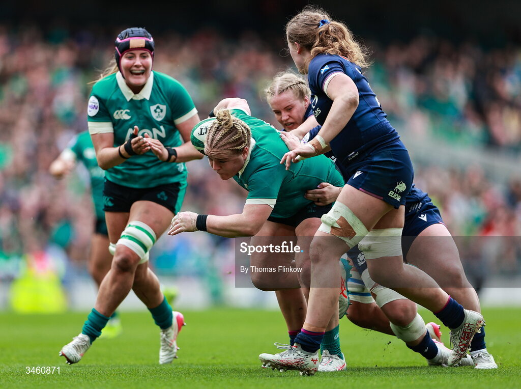 17 May 2026; Clíodhna Moloney-MacDonald of Ireland in action against Emily Coubrough, front, and Elis Martin of Scotland during the Women's 6 Nations Rugby Championship match between Ireland and Scotland at the Aviva Stadium in Dublin. Photo by Thomas Flinkow/Sportsfile