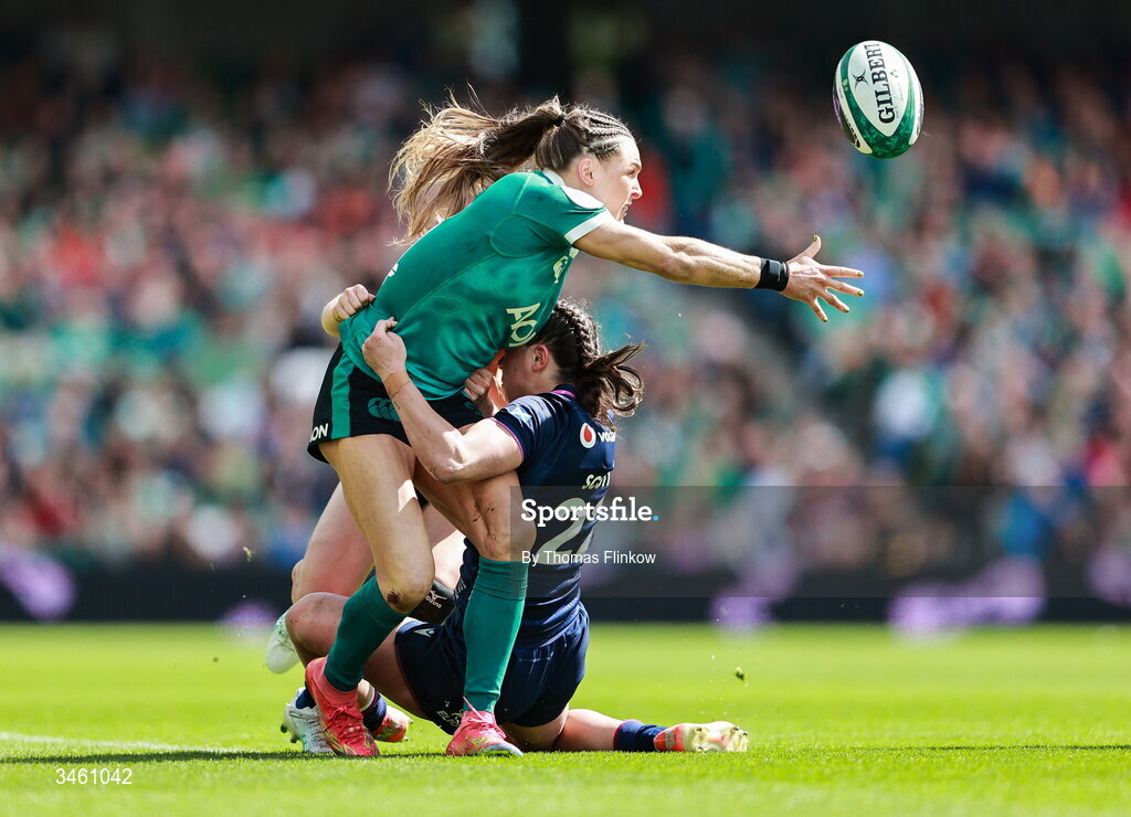 17 May 2026; Béibhinn Parsons of Ireland is tackled by Rhea Clarke, right, and Shona Campbell of Scotland, back during the Women's 6 Nations Rugby Championship match between Ireland and Scotland at the Aviva Stadium in Dublin. Photo by Thomas Flinkow/Sportsfile