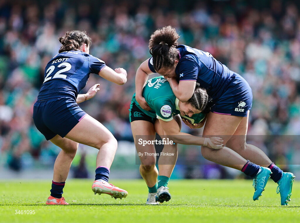 17 May 2026; Clíodhna Moloney-MacDonald of Ireland in action against Lucia Scott, left, and Aicha Sutcliffe of Scotland during the Women's 6 Nations Rugby Championship match between Ireland and Scotland at the Aviva Stadium in Dublin. Photo by Thomas Flinkow/Sportsfile