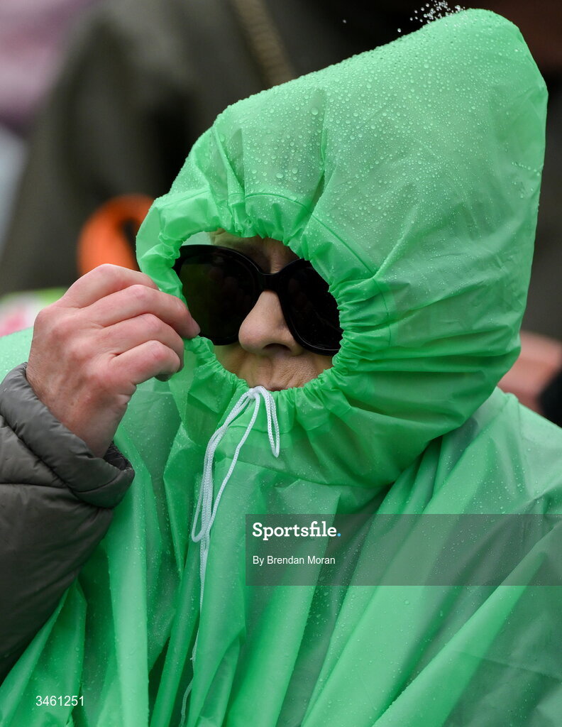 17 May 2026; A supporter shelters from the rain during the Munster GAA Senior Hurling Championship Round 4 match between Limerick and Waterford at TUS Gaelic Grounds in Limerick. Photo by Brendan Moran/Sportsfile